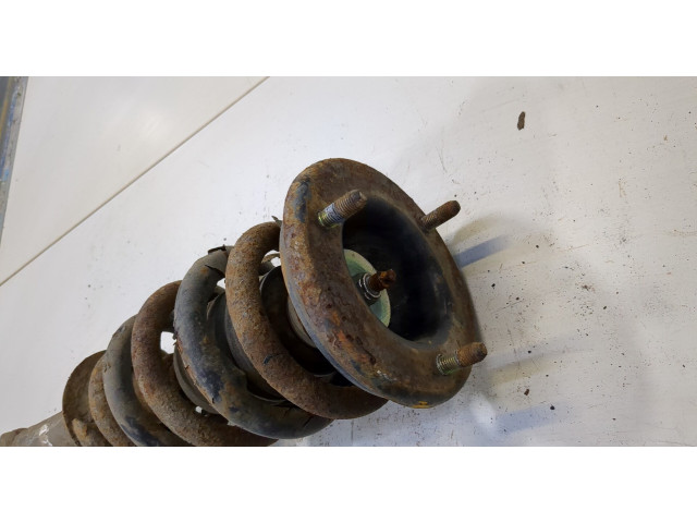 Стойка амортизатора Mitsubishi L200 2006-2015