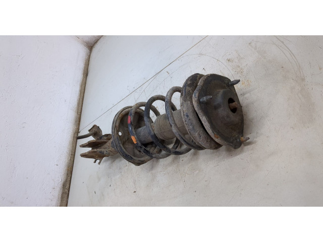 Стойка амортизатора  Mitsubishi Colt 1996-2004      