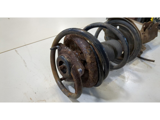 Стойка амортизатора Mitsubishi Outlander XL 2006-2012