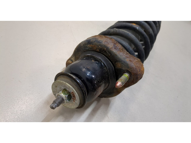 Стойка амортизатора Mitsubishi Outlander 2003-2009