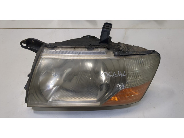 Фара передняя Mitsubishi Pajero / Montero 2000-2006 левая