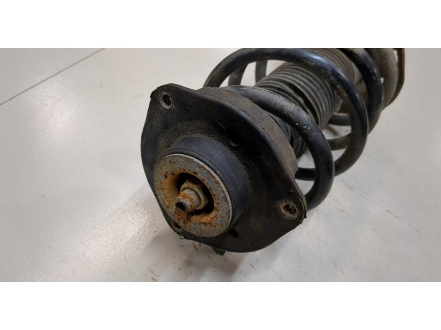 Стойка амортизатора  Volkswagen Caddy 2010-2015      