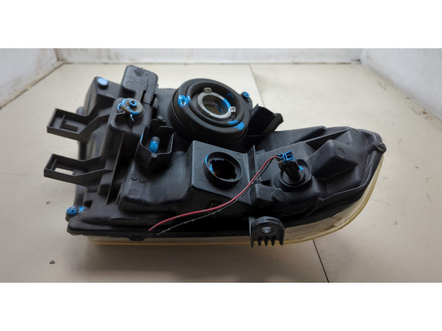 Фара передняя Nissan Pathfinder 2004-2014 левая