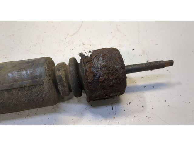 Стойка амортизатора  Nissan Tiida 2004-2010      