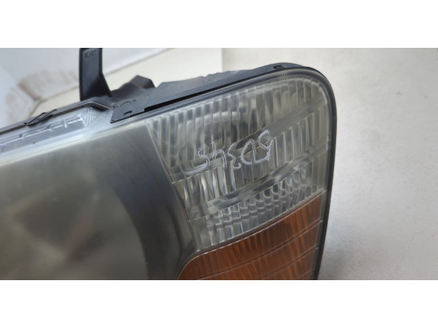 Фара передняя  Mitsubishi Pajero / Montero 2000-2006 левая 