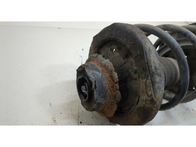 Стойка амортизатора  Mazda 626 1997-2001      