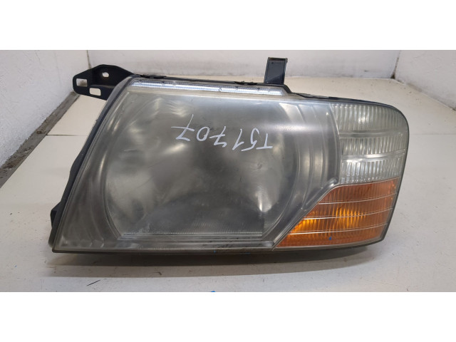 Фара передняя Mitsubishi Pajero / Montero 2000-2006 левая
