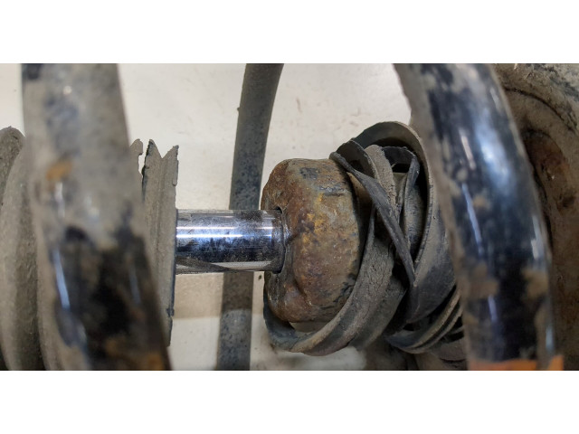 Стойка амортизатора Mitsubishi Outlander 2012-2015 гибрид