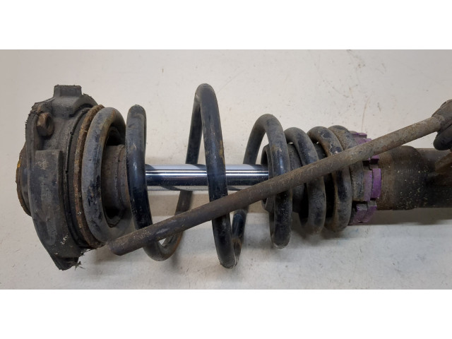 Стойка амортизатора Volkswagen Caddy 2004-2010