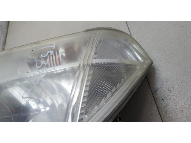 Фара передняя Nissan Pathfinder 2004-2014 левая