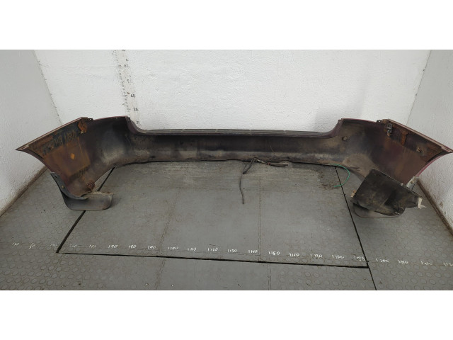 Бампер  KIA Carnival 1998-2006 задний   