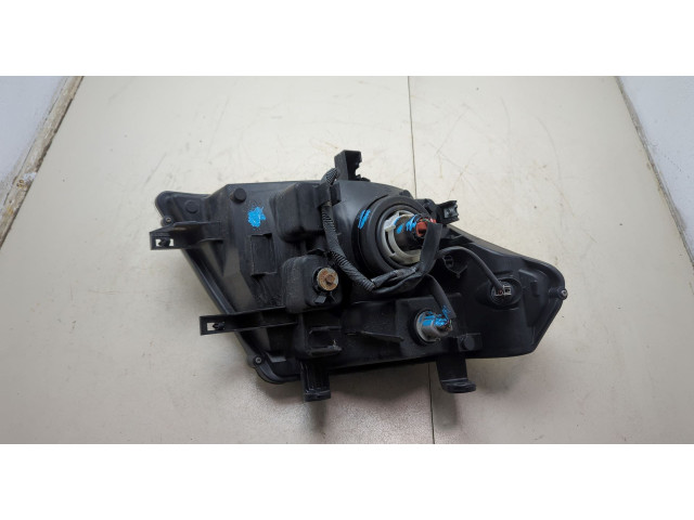 Фара передняя Nissan Pathfinder 2004-2014 левая