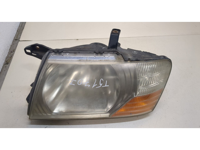 Фара передняя Mitsubishi Pajero / Montero 2000-2006 левая