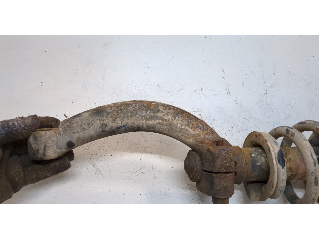 Стойка амортизатора  SsangYong Rexton 2012-2017      