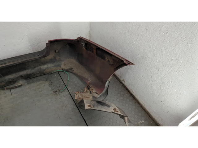 Бампер  KIA Carnival 1998-2006 задний   