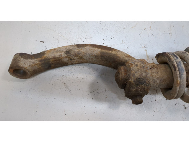 Стойка амортизатора  SsangYong Rexton 2012-2017      