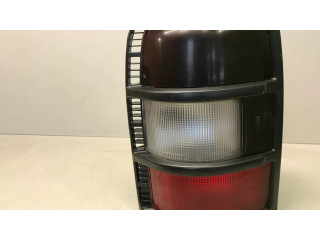 Задний фонарь левый сзади Mitsubishi Pajero 1991-1999 года