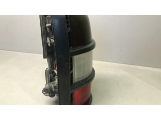 Задний фонарь левый сзади Mitsubishi Pajero 1991-1999 года