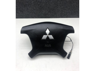 Подушка безопасности водителя 7030A099 Mitsubishi Pajero