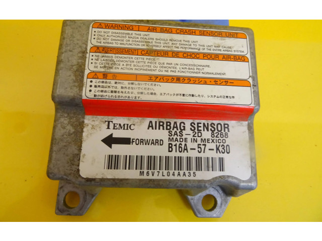 Блок подушек безопасности B16A-57-K30, B16A57K30   Mazda 323 F