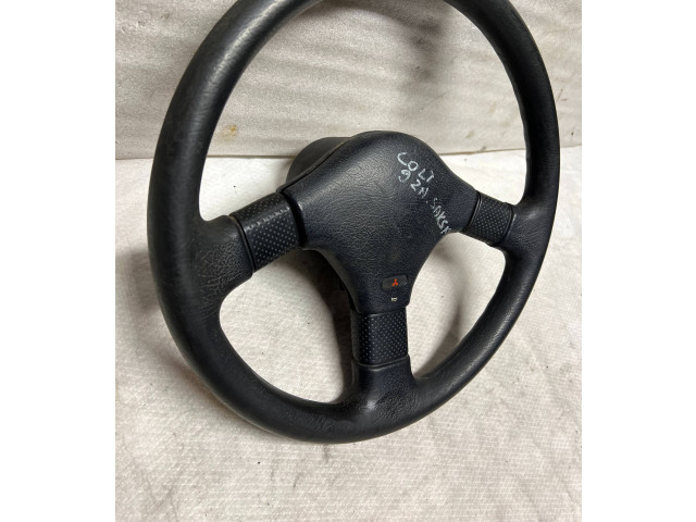 Руль Mitsubishi Colt 1989 - 1992 года MB564540, 1313