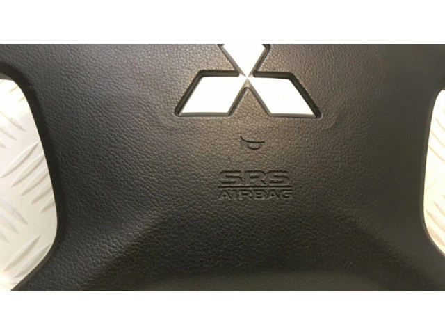 Подушка безопасности водителя 7030A099 Mitsubishi Pajero