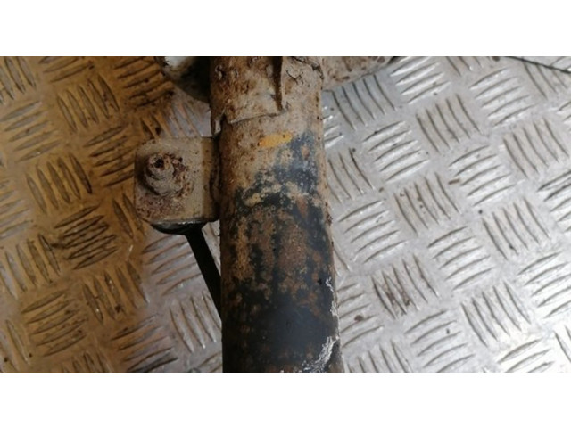 Передний амортизатор