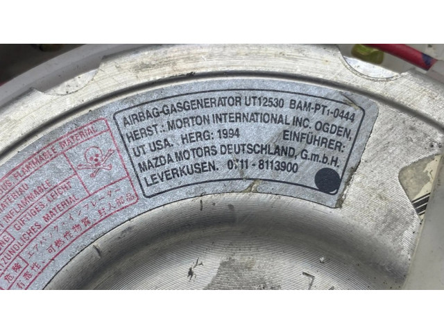 Подушка безопасности водителя BC5A57K00, T93013A Mazda 323