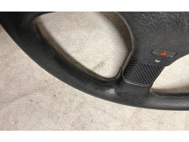 Руль Mitsubishi Colt 1989 - 1992 года MB564540, 1313