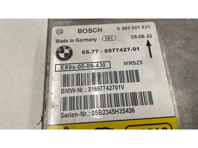 Turbodmychadlo Блок управления надувных подушек 6977427, 31697742701V   BMW 1 E81 E87 2.0  M47