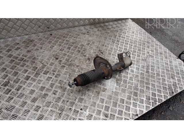 Передний амортизатор