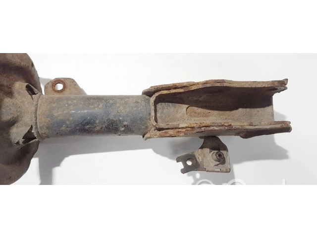 Передний амортизатор