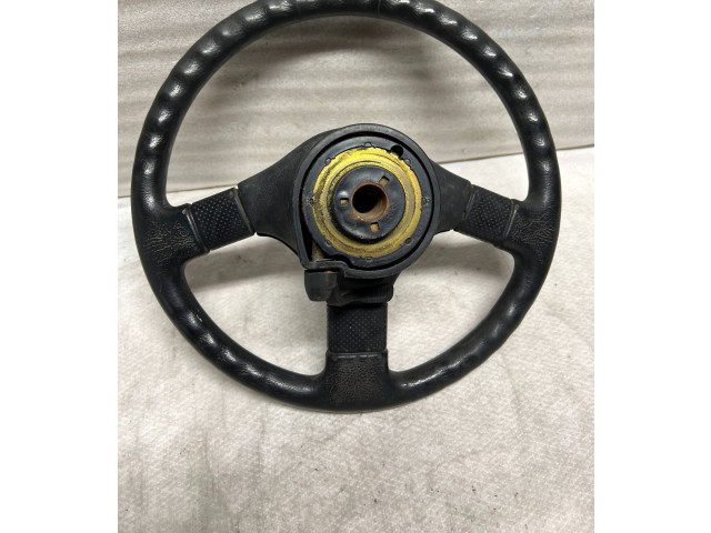 Руль Mitsubishi Colt 1989 - 1992 года MB564540, 1313