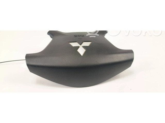 Подушка безопасности водителя 7030A099 Mitsubishi Pajero