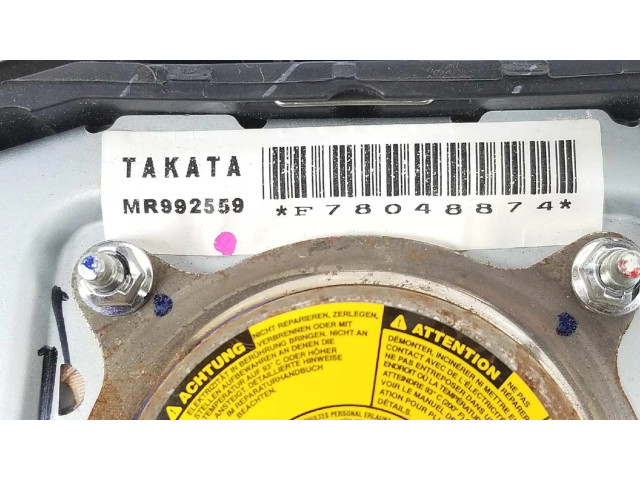 Подушка безопасности водителя 7030A851XA Mitsubishi L200