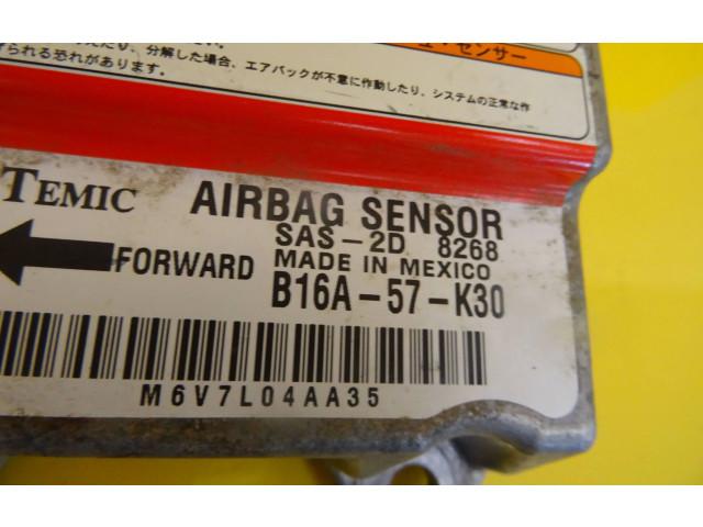 Блок подушек безопасности B16A-57-K30, B16A57K30   Mazda 323 F