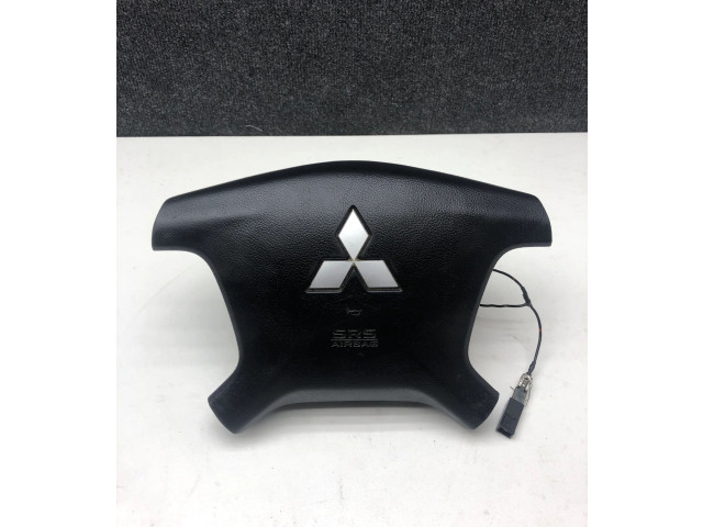 Подушка безопасности водителя 7030A099 Mitsubishi Pajero