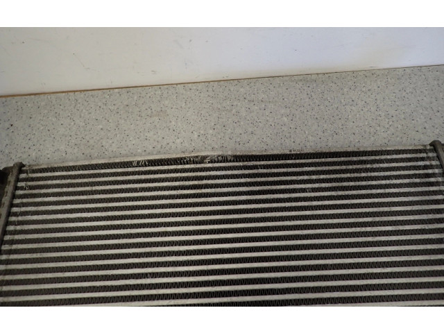 Радиатор интеркулера    KIA Carens II