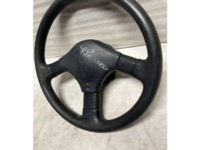 Руль Mitsubishi Colt 1989 - 1992 года MB564540, 1313