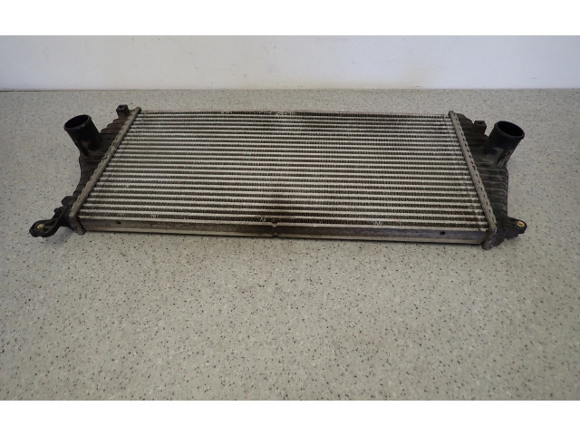 Радиатор интеркулера    KIA Carens II