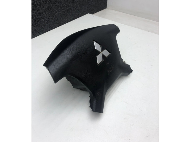 Подушка безопасности водителя 7030A099 Mitsubishi Pajero