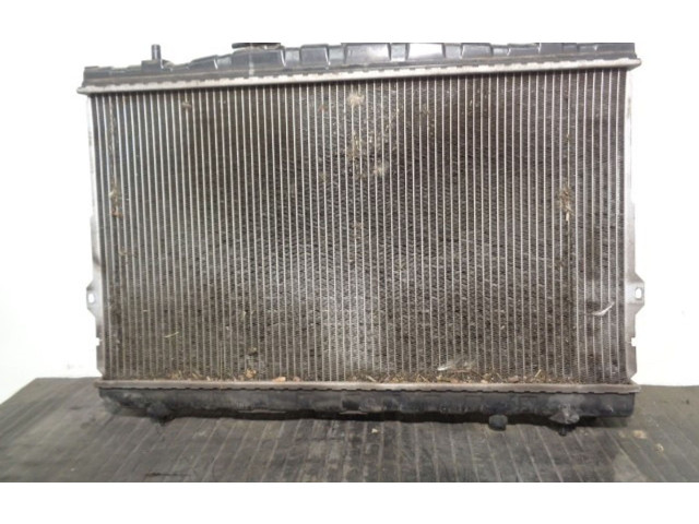 Радиатор охлаждающей жидкости    253102D000, 67494   Hyundai Coupe