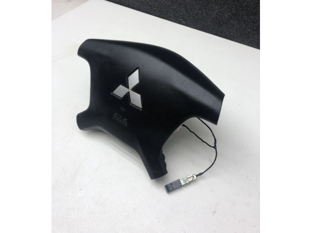 Подушка безопасности водителя 7030A099 Mitsubishi Pajero